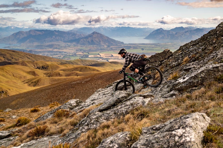 A mountain biker descends in New Zealand.